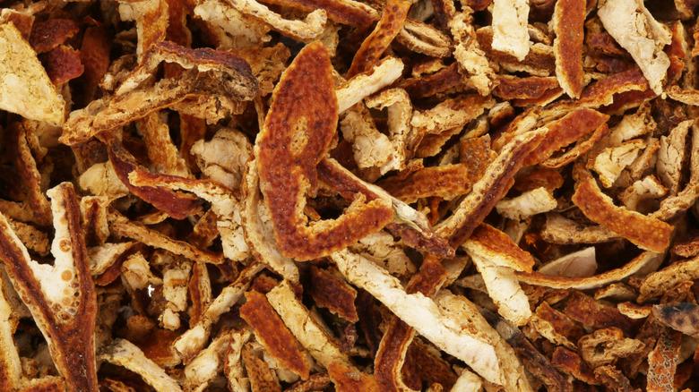 A close up of dried strips of orange peel.