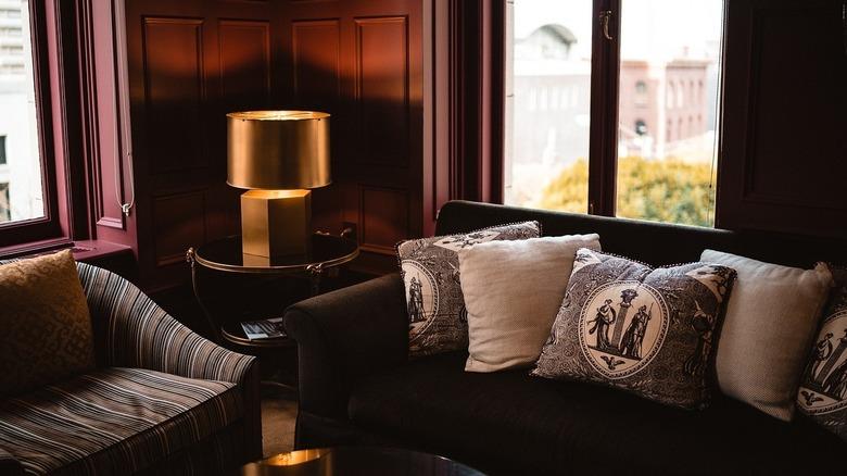 black couch with burgundy walls