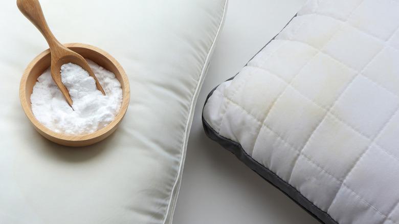 Baby powder next to stained pillow