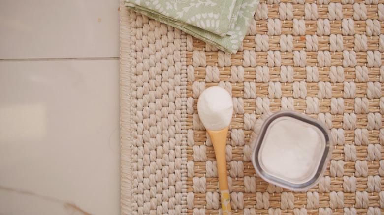 Baby powder in dish by rug