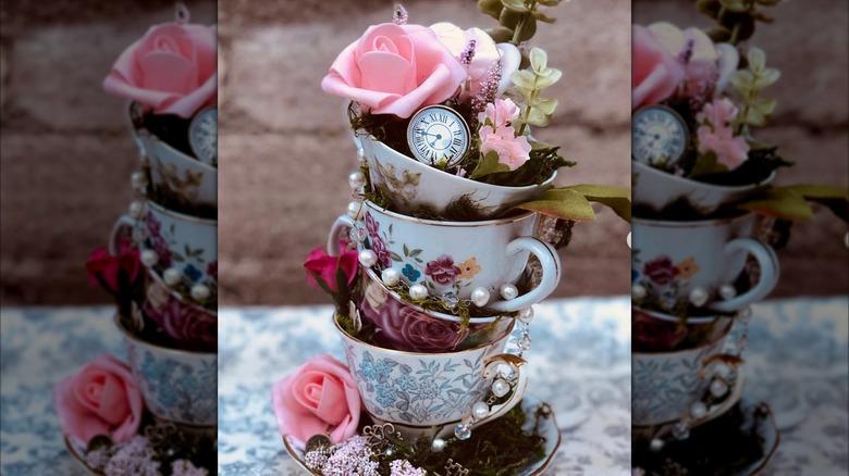Whimsical centerpiece made of vintage tea cups and flowers