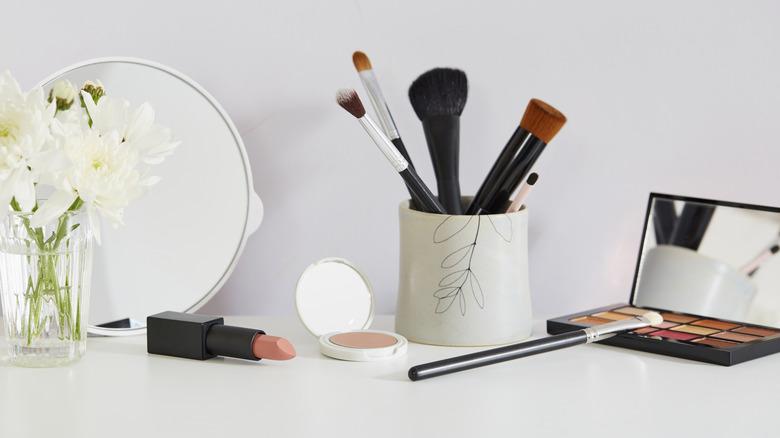 Makeup brushes in cute coffee cup