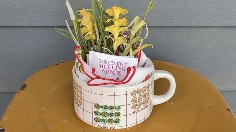 Coffee mug filled with flowers