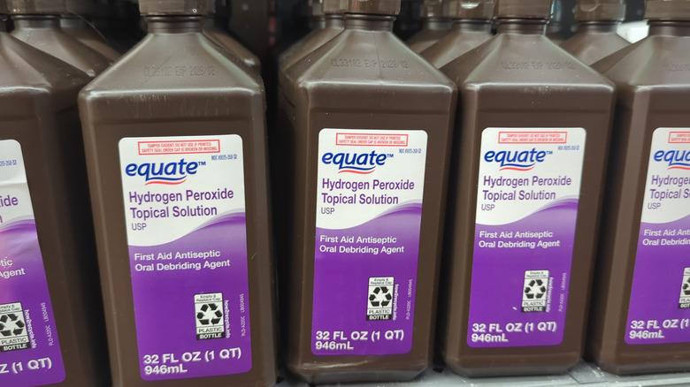 Bottles of topical hydrogen peroxide on a store shelf.