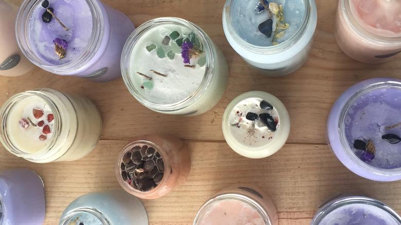 glass jars that were repurposed to be diy candles