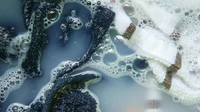towels in soapy water