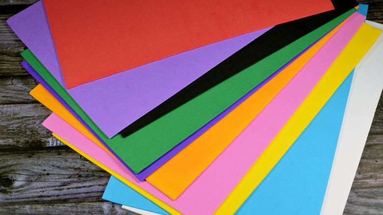 pile of colorful foam core board on wood background