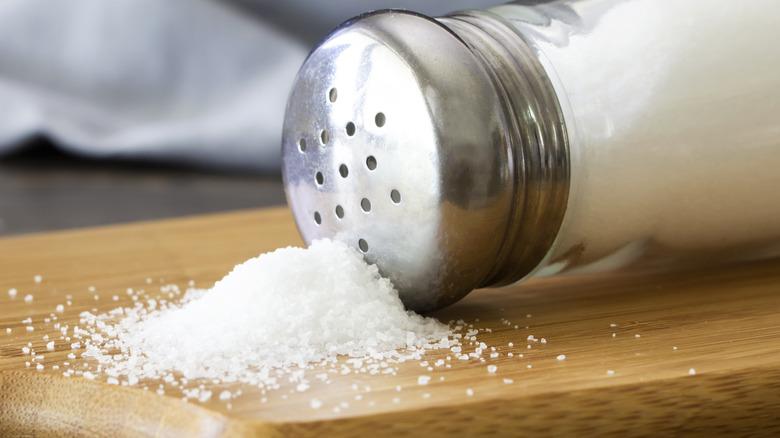 Close up of a saltshaker and salt