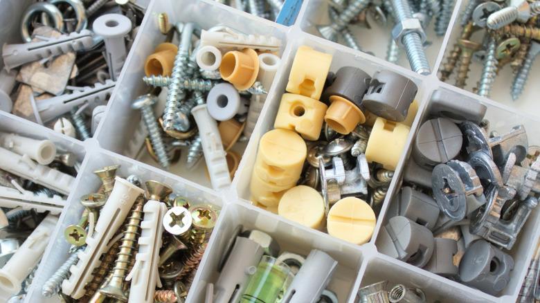 Collection of loose, mismatched screws and anchors