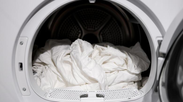 White bedsheets in a dryer