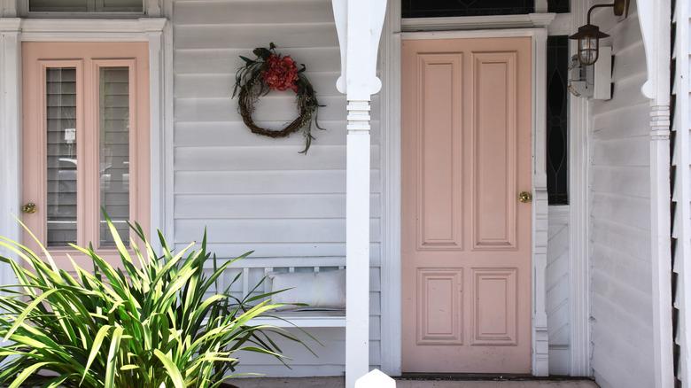 white house with pale pink front door
