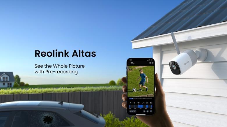 Reolink Altas camera and person holding mobile device