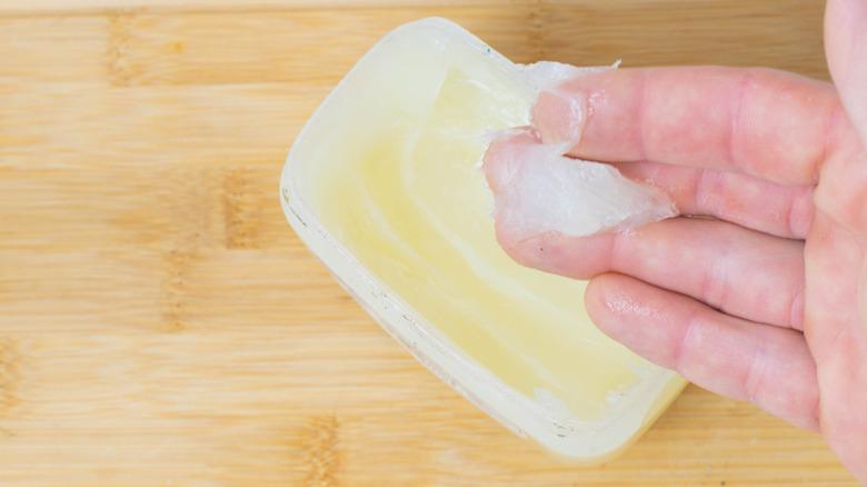Vaseline container on wooden surface