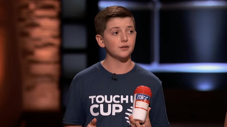 Young Carson Grill presenting product on Shark Tank stage